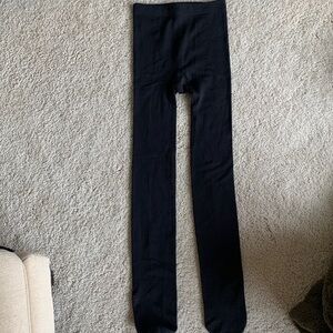 Fleece lined black tights with hole that could probably be seen back together